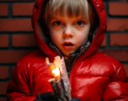A portrait of a young child holding a firecracker, diwali festival stock image, diwali festival ai prompt