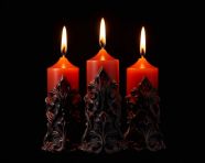 Three lit candles facing each other black background, diwali festival stock image, diwali festival ai prompt