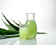 Glass of aloe vera juice with leaves, alovera leaf image
