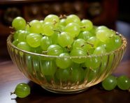Green gooseberry fruits in a bowl, gooseberry fruit image