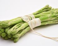 Freshly cut asparagus wrapped in white string, asparagus image