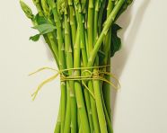 Asparagus shoots on a white table, asparagus image