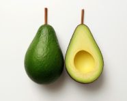 Two halves of an avocado on a white background, avocado image stock photo