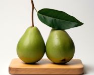 Two avocados on a wooden board on white background, avocado image stock photo