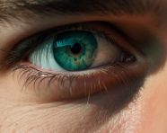 Blue eyes in the spotlight, men eyes close up image