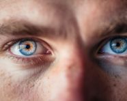 Handsome man with stunning blue eyes, men eyes close up image