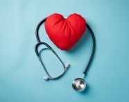 Heart and stethoscope on blue background, medical images stock