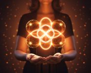 A woman's hand is holding up a glowing plus, medical images stock