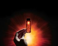 A persons hand reaches out from the darkness, medical images stock