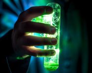 Test tube in scientist's hand, medical images stock