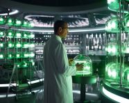 Researcher in lab coat standing tall, medical images stock