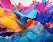 Brightly colored liquids are being spread in the air, alcohol ink art
