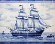 An image of a sailboat in a blue and white tile, azulejo art