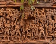 Carvings on the stone wall of the old temple area, bas relief art