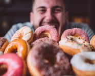 Joyful eater with mouth full of food