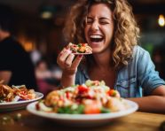 Friends laughing over burgers