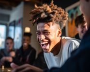 A person laughing as they play a game