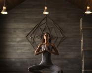 Woman stretches in yoga studio