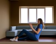 A young woman is doing a routine of arm and upper back