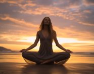 Girl practicing yoga on beach at sunset yoga