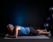Man working out abs on dark background