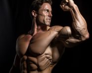 Muscular man shows off his biceps