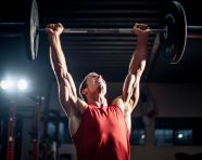 The athlete is lifting the weight overhead with ease