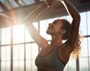 Strong woman in activewear working out