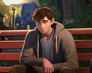 Young man relaxing on park bench