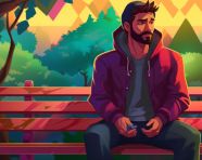 Guy in hoodie taking a break on park bench