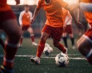 Soccer player dribbles ball through defenders