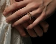 Bride and groom s intertwined hands