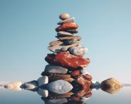 Stacked stones on watery surface
