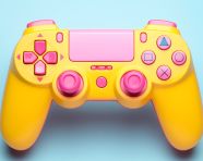 Yellow and pink video game controller