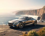Car on cliffside overlooking sea