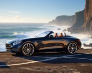 Car parked on cliff overlooking ocean