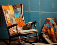 Old rocking chair with patchwork quilt