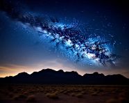 The milky way stretches across the night sky