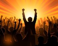 A person is standing in front of a crowd of people