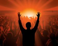 A person is standing in front of a crowd of people giving a speech