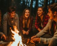 Group of friends bonding around campfire