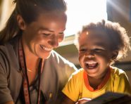 A volunteer is helping a child learn to read