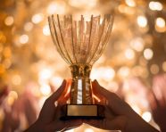 Hands clasped around trophy