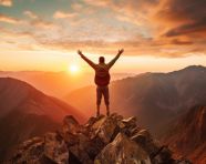Adventurer stands atop mountain