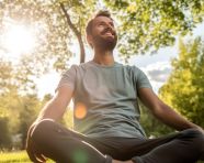 A person sitting in a park enjoying the fresh air and sunshine