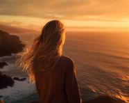 Young woman embraces the sea