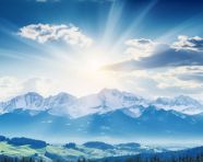 Snow capped peaks in the faraway horizon