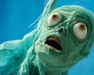 Green puppet made from stocking