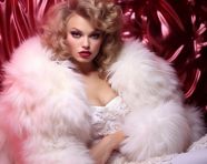 Fashion model in white fur boots