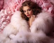 Fashion model in white fur coat